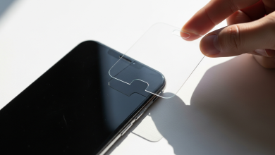 Smartphone with tempered glass screen protector being applied (illustrative)